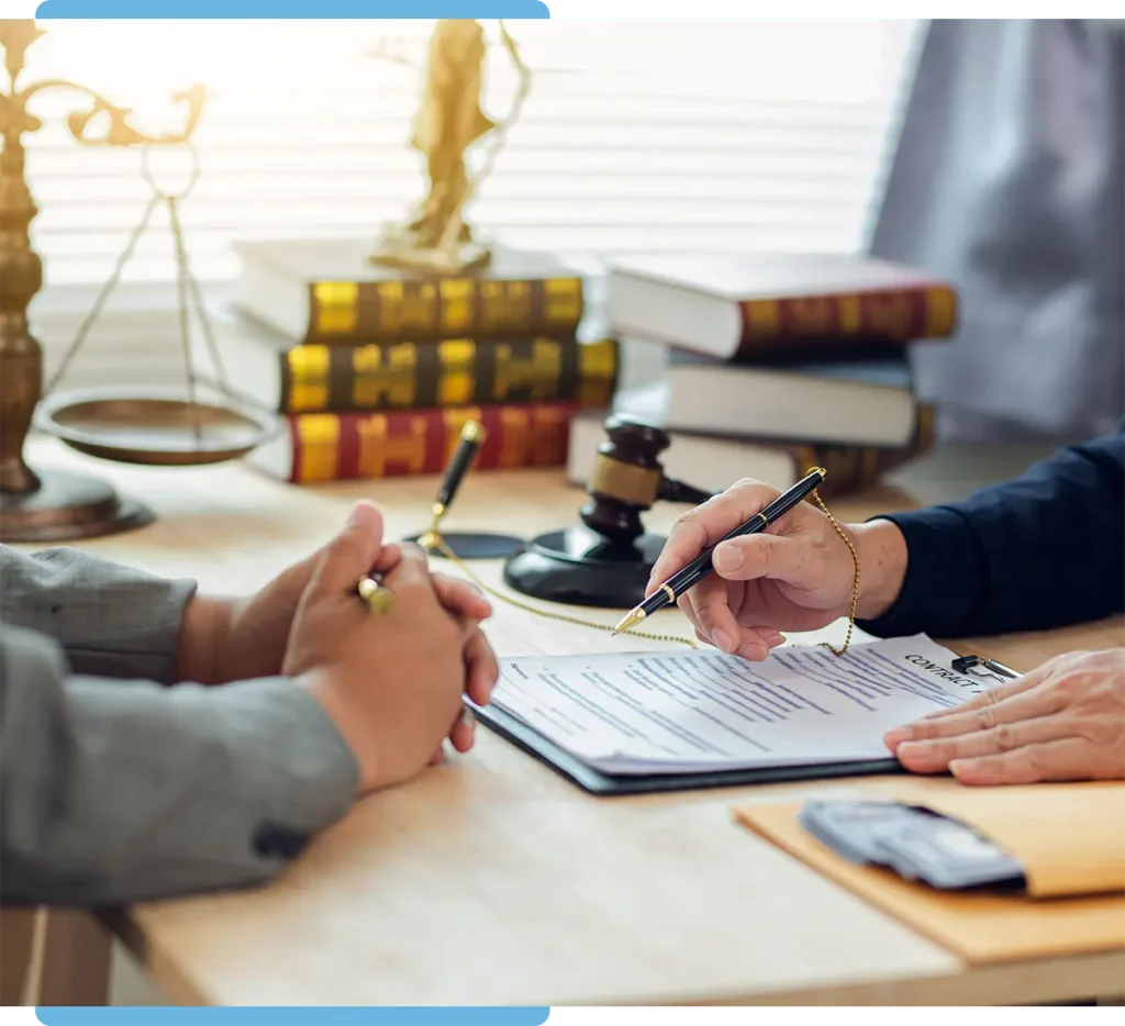 personal injury attorney signing a contract with a client